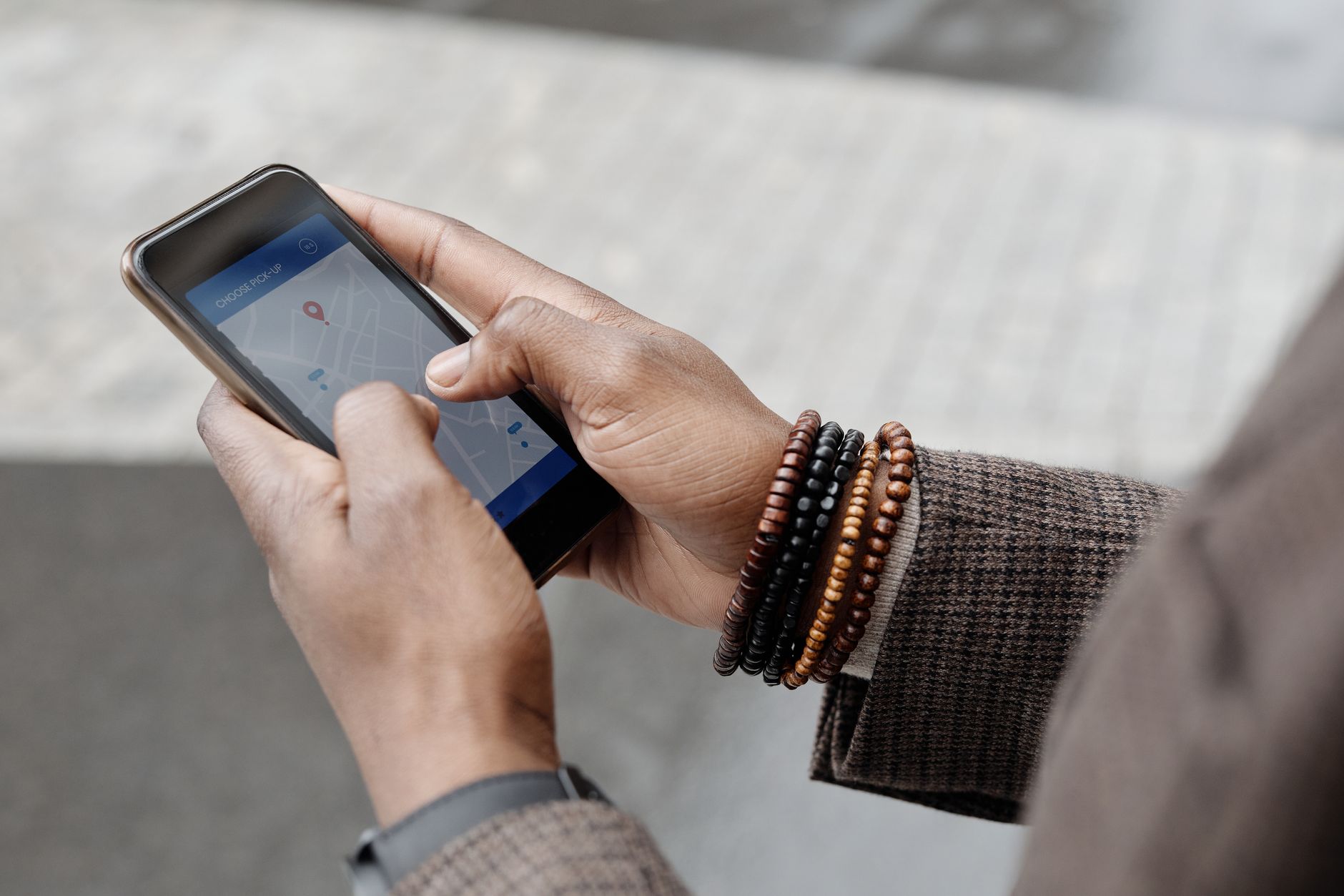 A hand holds an Android phone with Google Gemini visible on screen
